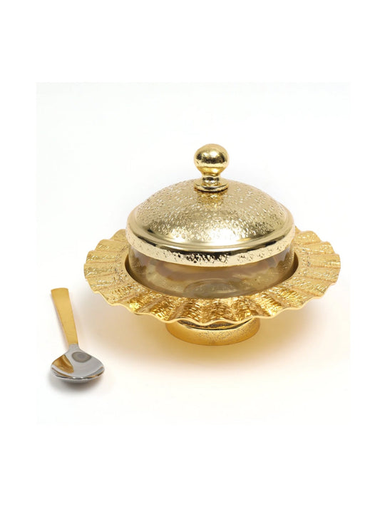 Versatile glass jar with stainless steel gold lid and matching spoon. Ideal for sugar, honey, jam. Measures 6W x 5H inches.