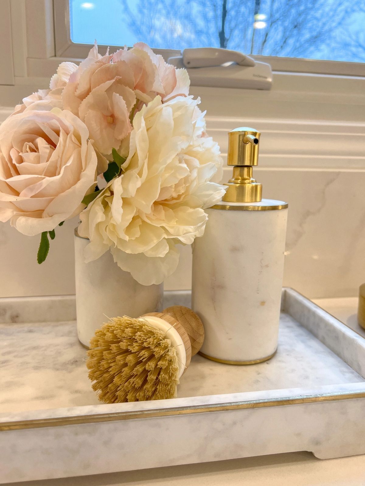 White marble dispenser with gold pump for soap or lotion sold by KYA Home Decor.
