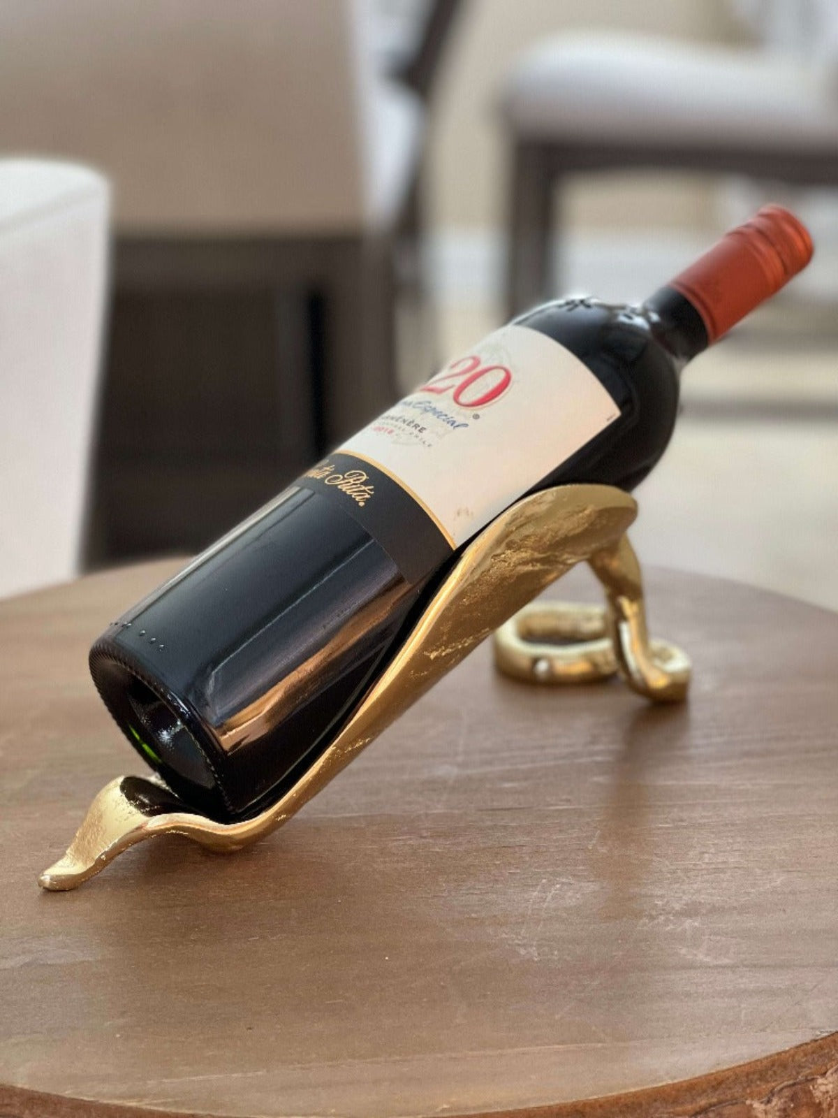 With a charming gold leaf design, display your favorite bottles of wine in your home with the Tree Leaf Bottle Holder. The rack features an elegant gold finish that looks great while holding up your favorite bottle of wine!