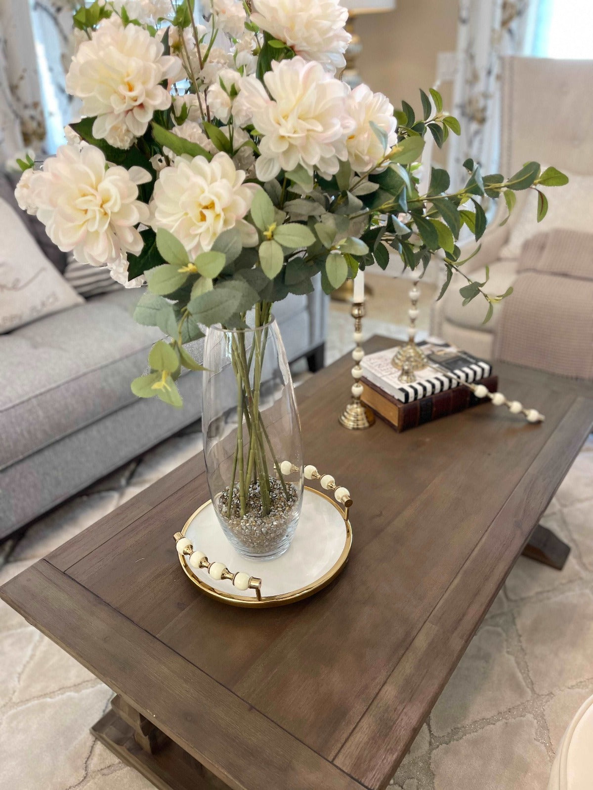 White and Gold Round Ceramic Tray with Beaded Design Handles, Displayed with Faux Flowers.