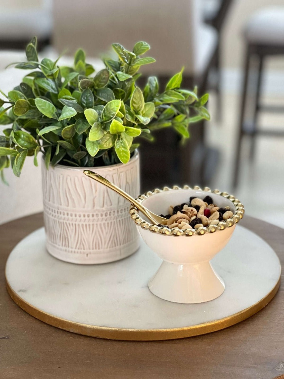 Situated on a stand, these gold edged dessert bowls elegantly close a meal. Its pure white color makes it the ideal dish to fill with colored berries and melons for a charming Completion of Feast.