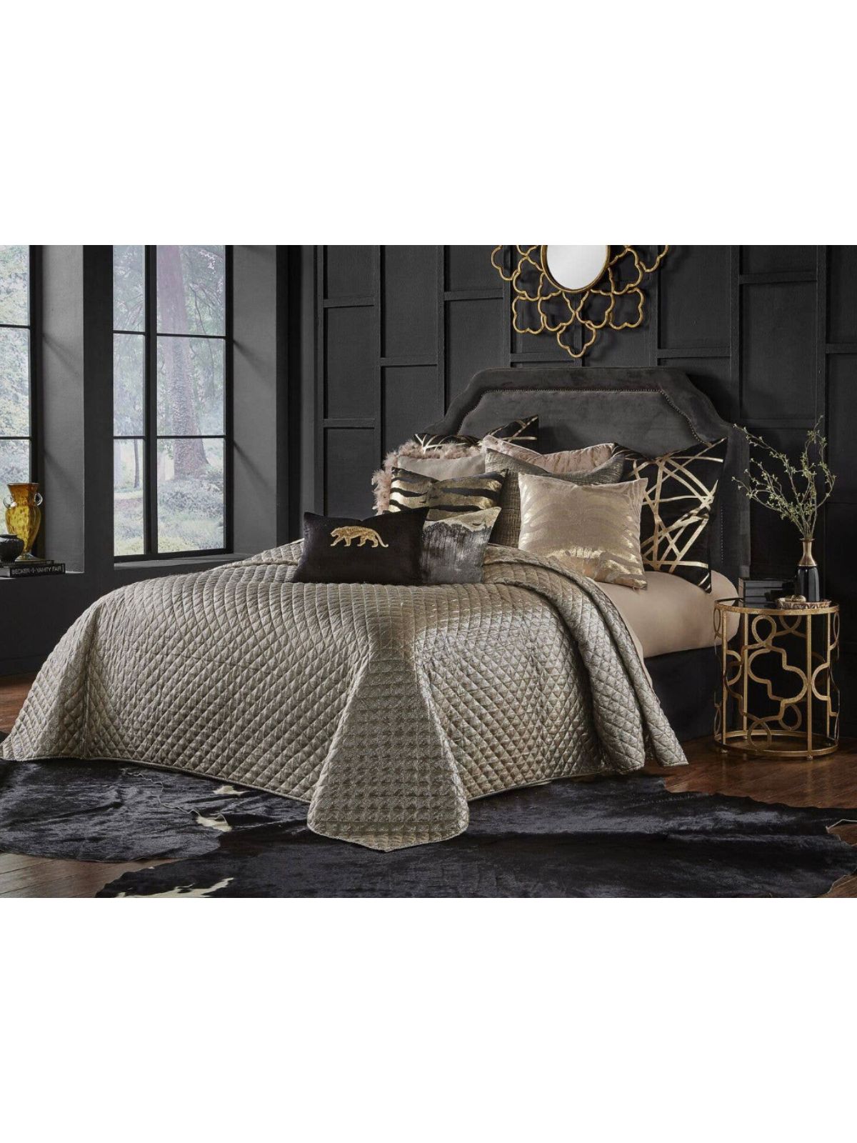 The silver Aura quilt features a woven fabric with a metallic chevron pattern which is quilted in a diamond box pattern. This shimmery quilt will add glitz and glamor to any room.