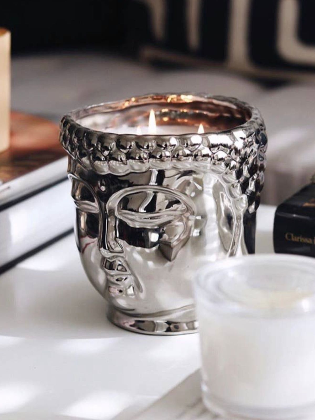 This 40oz Metallic Buddha scented candle is hand-sculpted and hand-poured in the USA with only the finest essential oils and 3 lead-free cotton wicks that provide a clean burn.