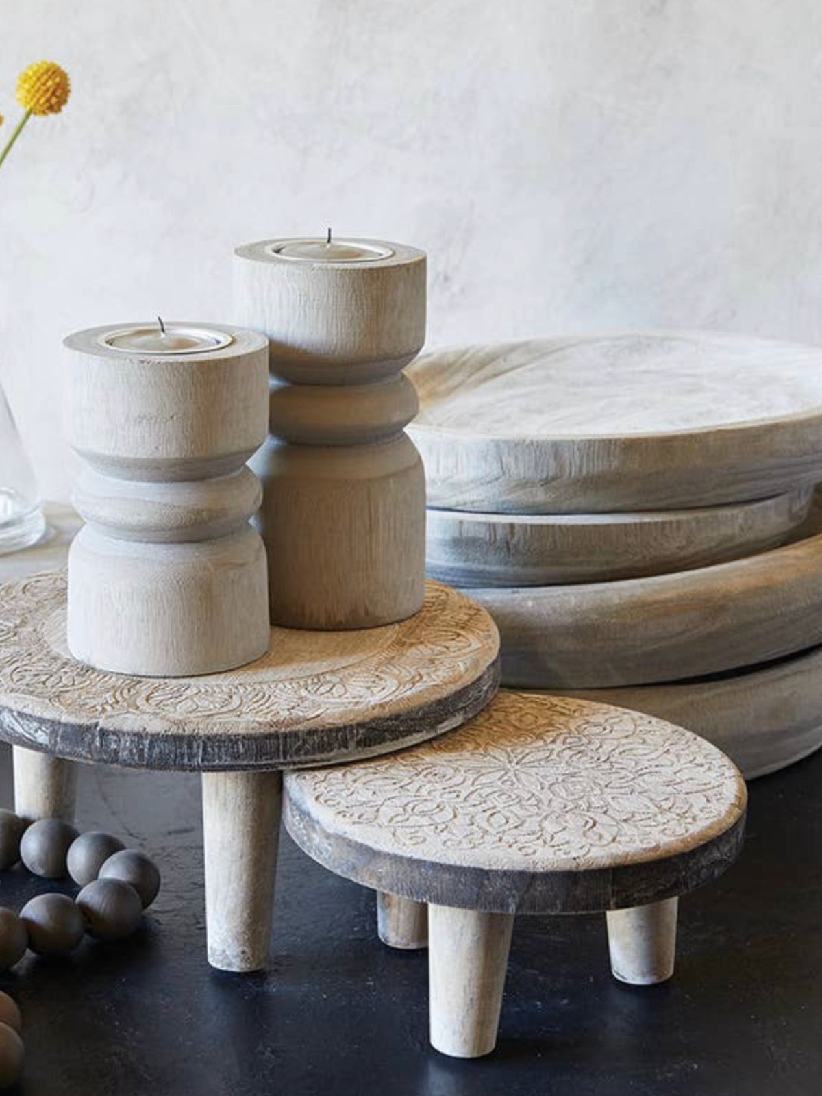 This beautiful riser adds an elegant charm to your decor. Perfect for style while showing its decorative flair. Made from paulownia wood and with a unique etched design.