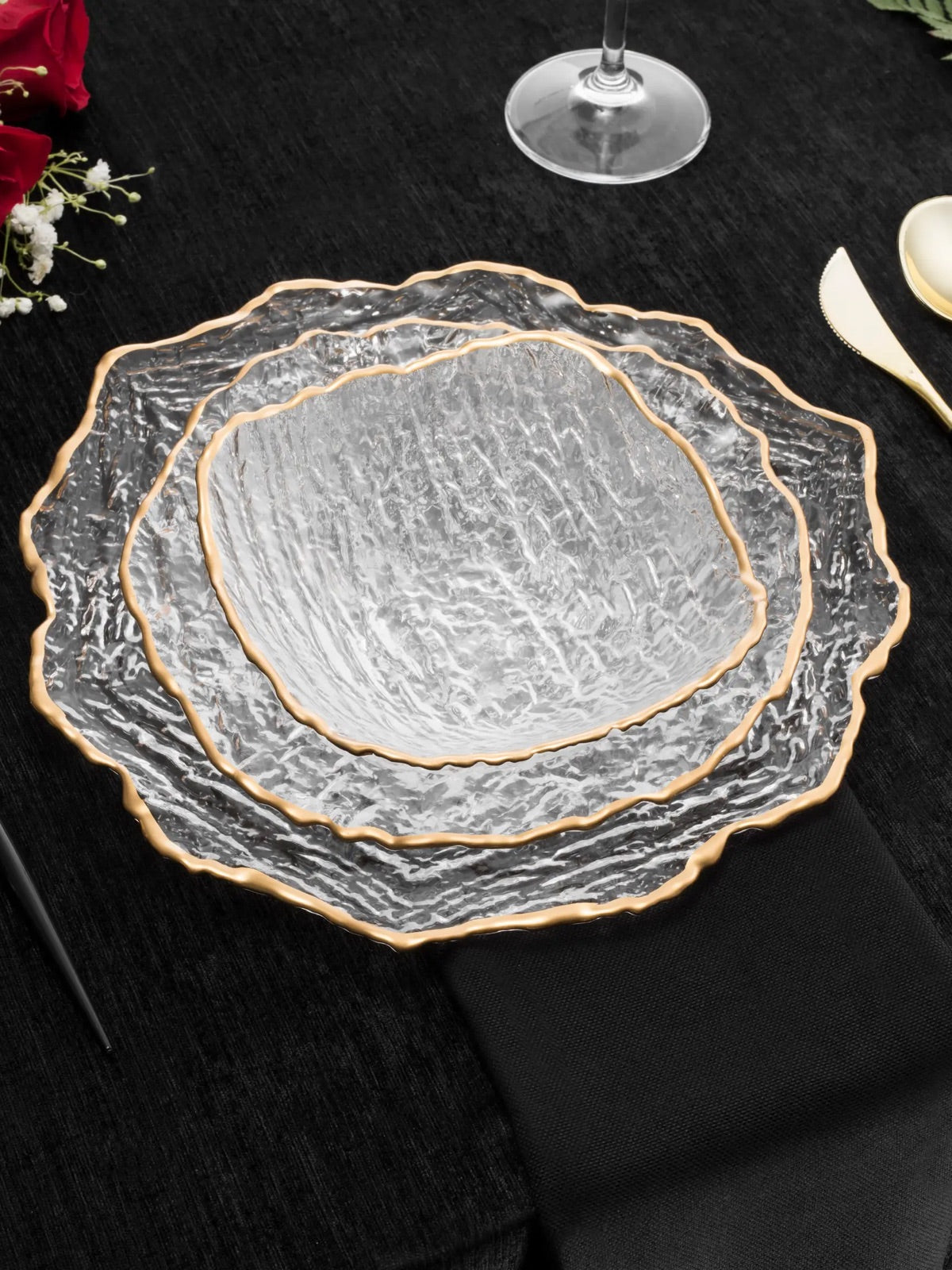 Serving your guest on this plates will defiantly make a statement. This set of 12 plates were constructed out of crushed glass material and designed with a gold trim.