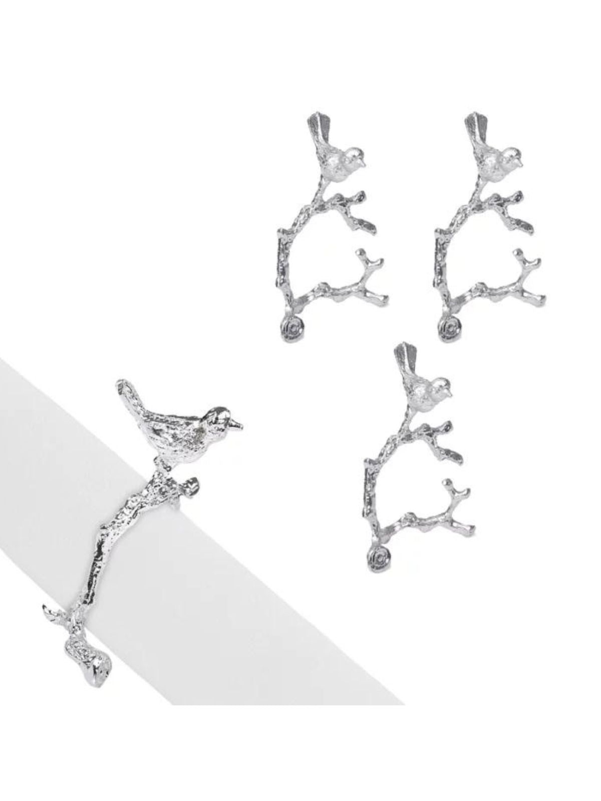 Set of 4 Silver Bird On Twig Designed Stainless Steel Napkin Rings Sold by KYA Home Decor.