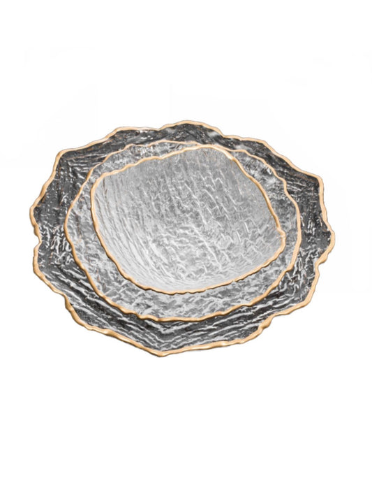Serving your guest on this plates will defiantly make a statement. This set of 12 plates were constructed out of crushed glass material and designed with a gold trim.