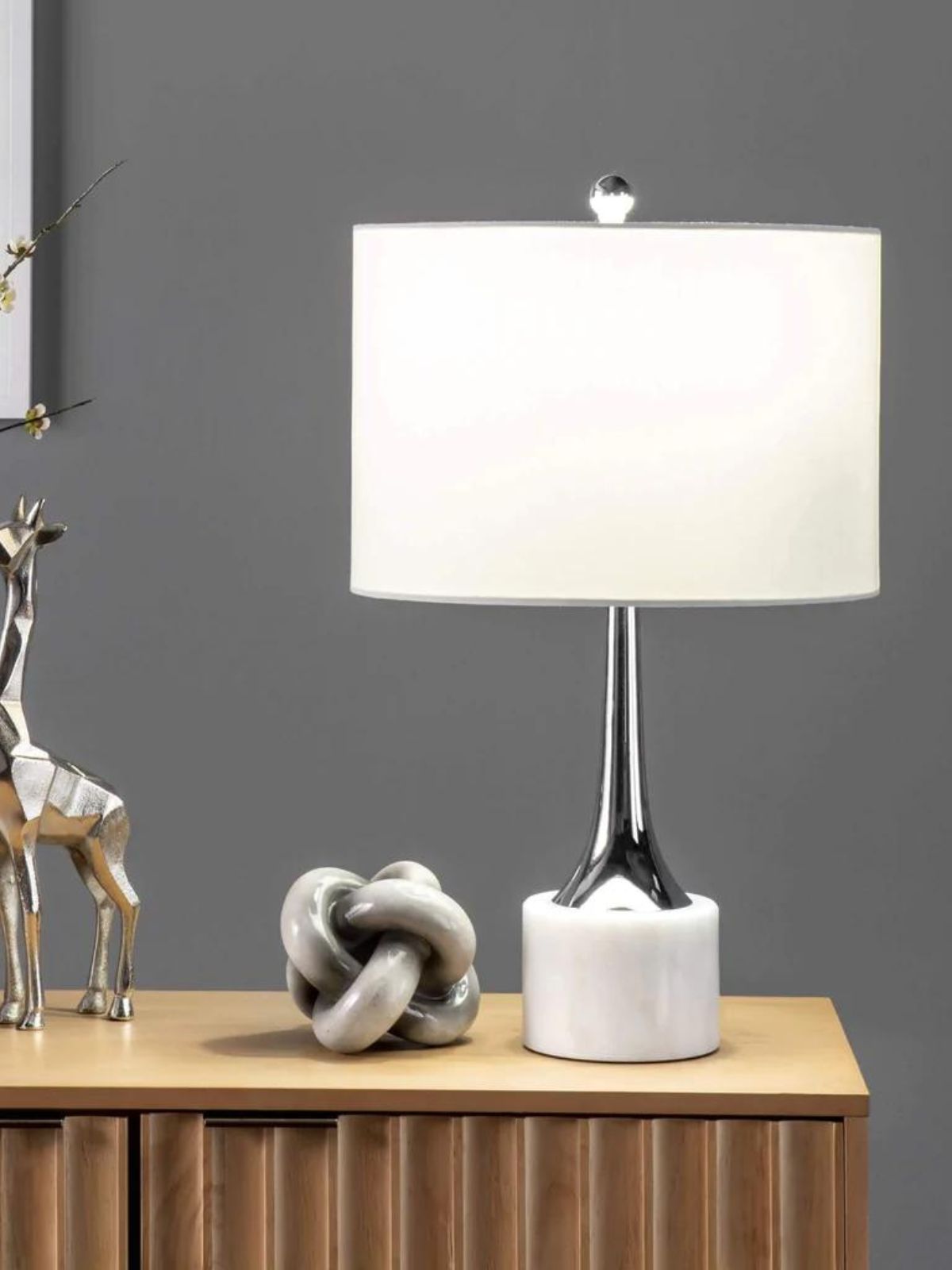 White and Silver Table Lamp on Marble Base and White Linen Drum Shade.