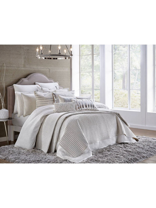 The Maya white and silver velvet quilt has a dominant silvery metal layer. The shiny silver will pair well in any toned-down area.