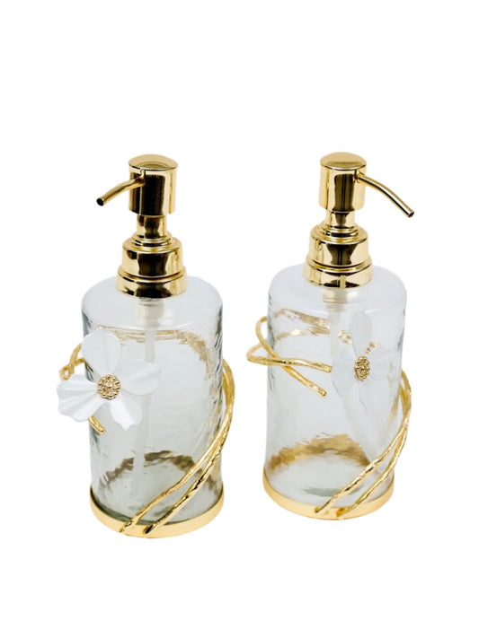 Elegant glass soap and lotion dispenser with a gold jewel flower design, adding a luxurious touch to your bathroom or kitchen décor.