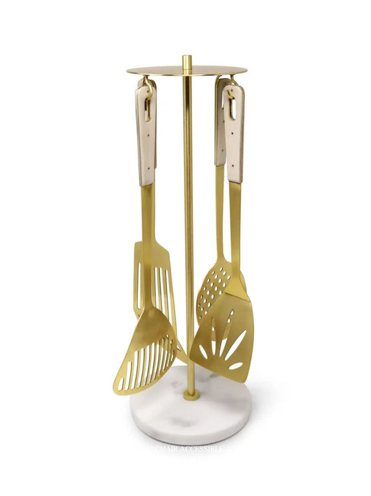 Set of 4 gold serving utensils with marble handles, including a serving spoon, slotted spoon, fork, and ladle sold by KYA Home Decor.