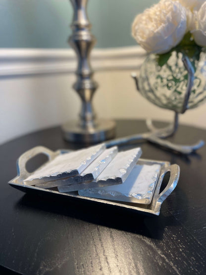 These beautiful marble coasters will bring that extra elegance to every table setting. They come in sets of 4, with a silver edge to give the finishing touch