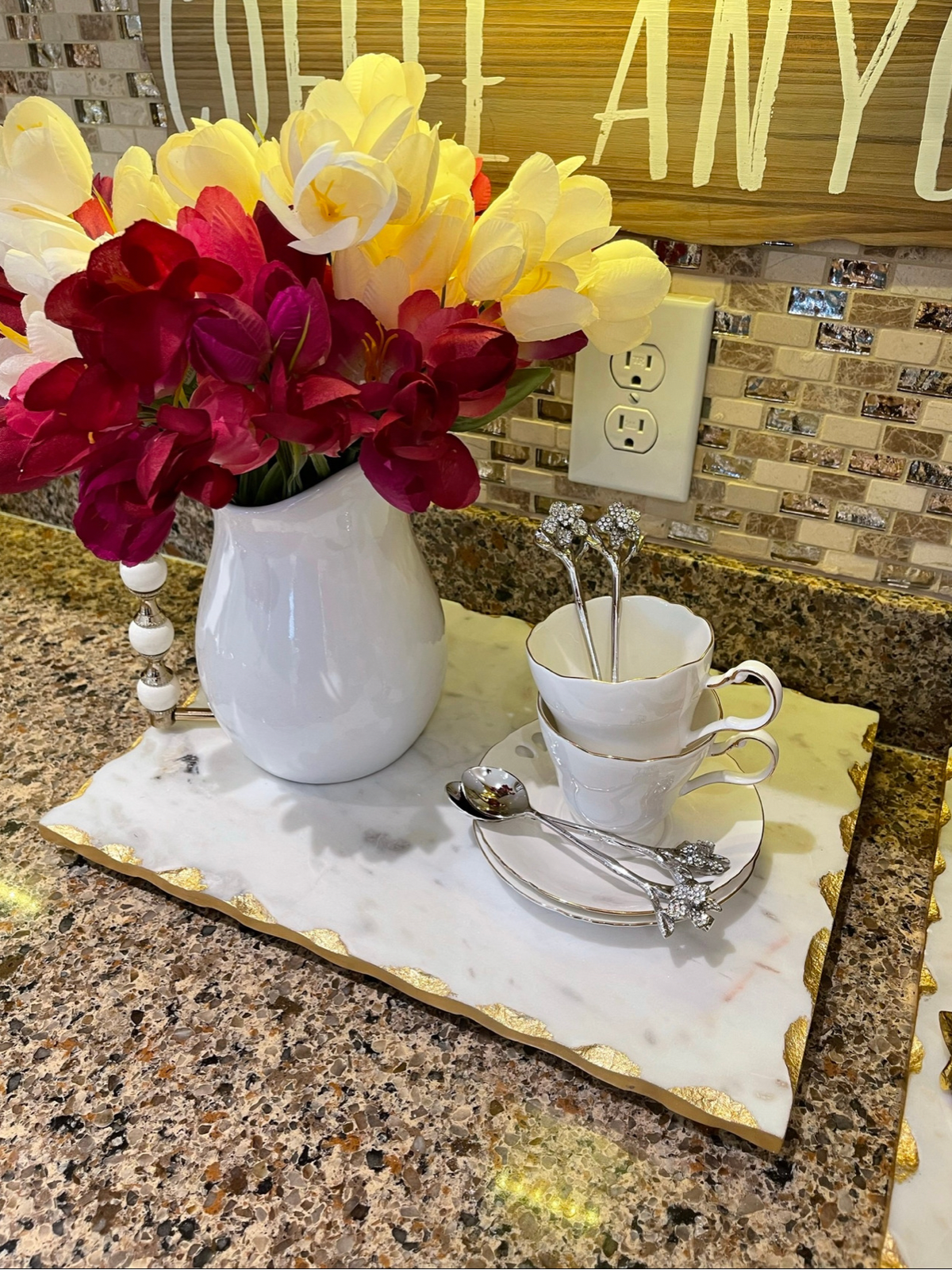 Set of 4 hammered stainless steel spoons adorned with exquisite jeweled flower handles.