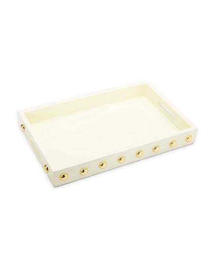 This stunning wooden tray with its shiny gold studs is a statement maker. Available in 3 colors to blend with any home décor style! Measures 16L Sold at KYA Home Decor