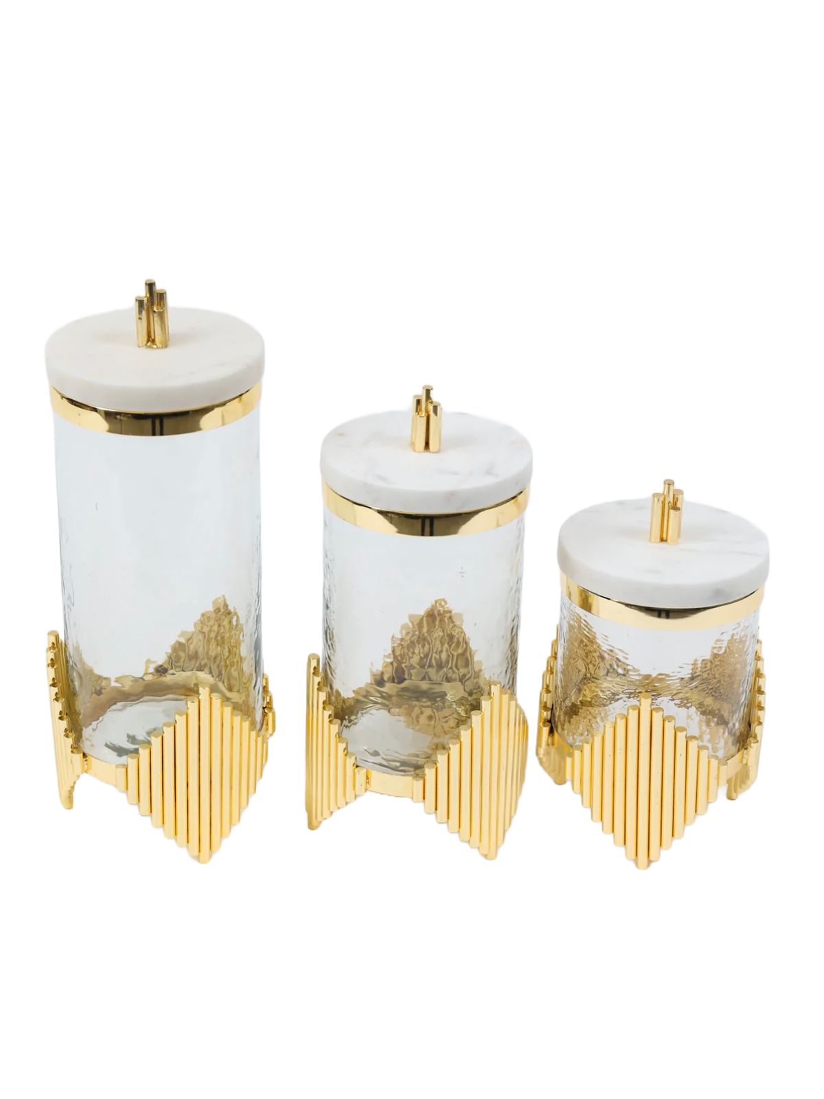 Luxurious glass canisters with gold metal diamond shaped base and marble lid. Available in 3 sizes and sold by KYA Home Decor