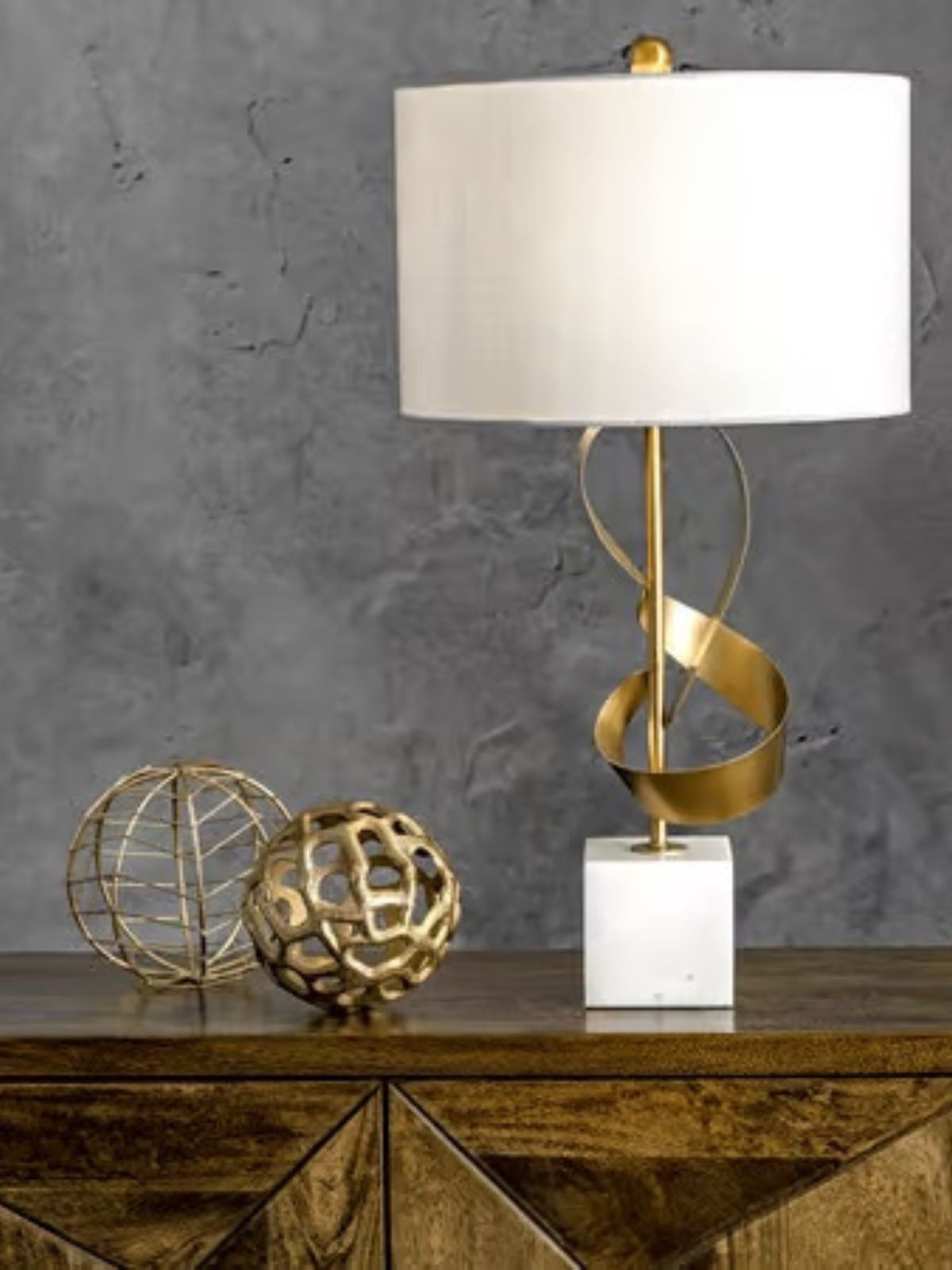 Gold Metal Ribbon Table Lamp on Marble Base sold by KYA Home Decor.