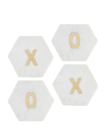 Add a loving touch to your home with our White Marble XOXO Coaster Set. This set includes 4 white marble coasters in the shape of hexagons, 2 with an X and 2 with an O at the center. Available at KYA Home Decor
