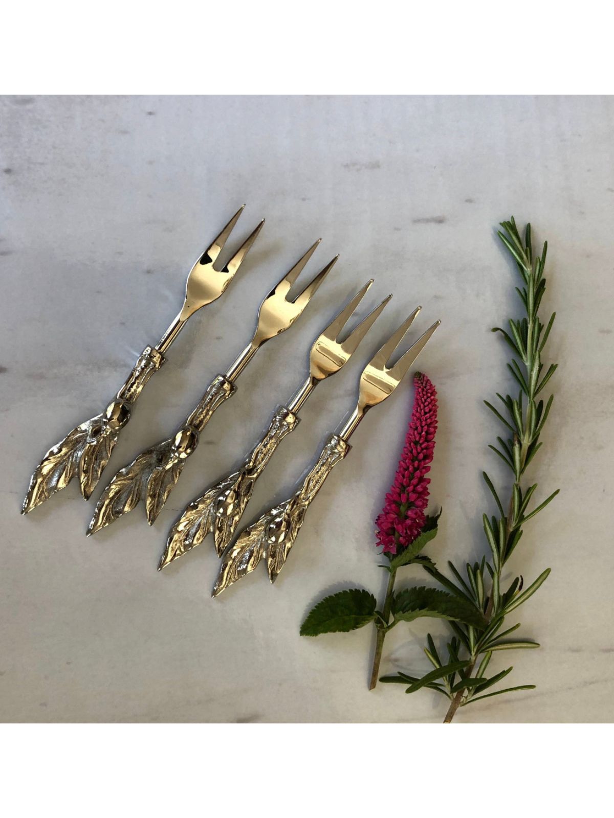 Stainless Steel Forks with Olive Branch Designed Handles Sold by KYA Home Decor.