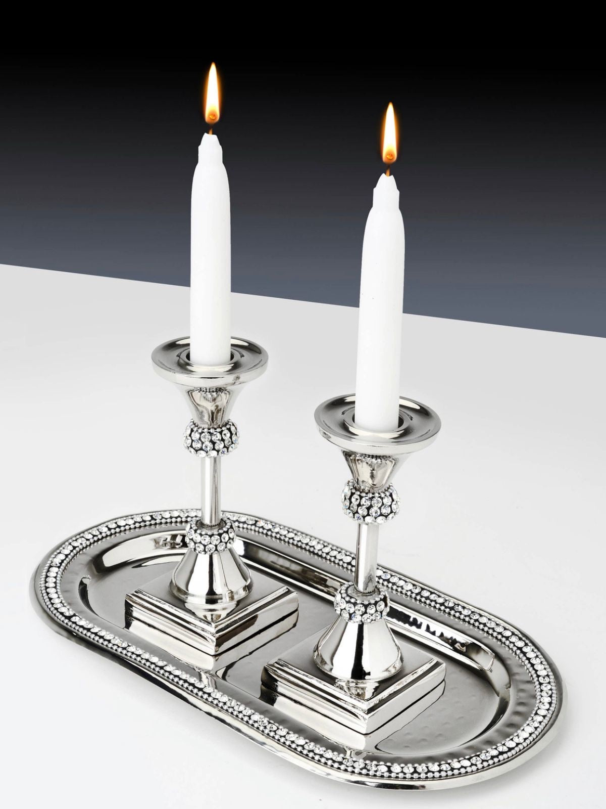 L Stainless Steel Oval Tray with Diamond Edges adorned with Candles.