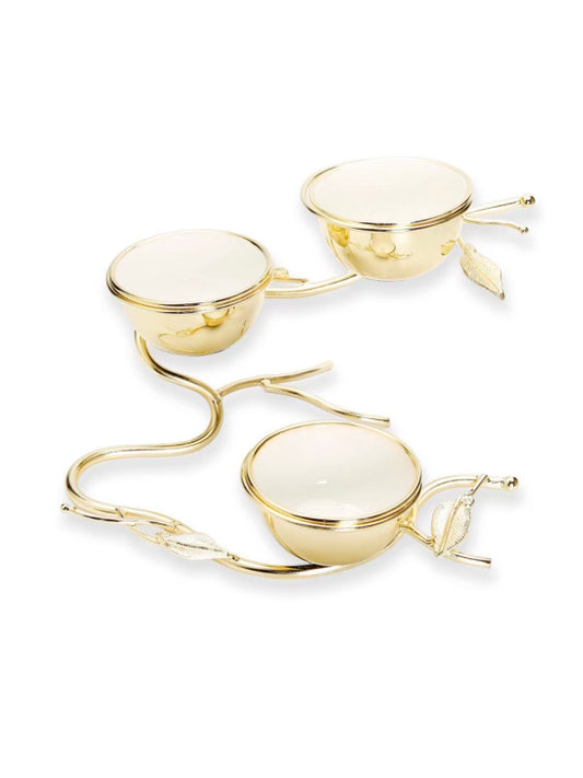3-sectional gold dish with white inline sitting on a stainless steel gold leaf base. Measures 12.75L x 8.5W x 7.25H.