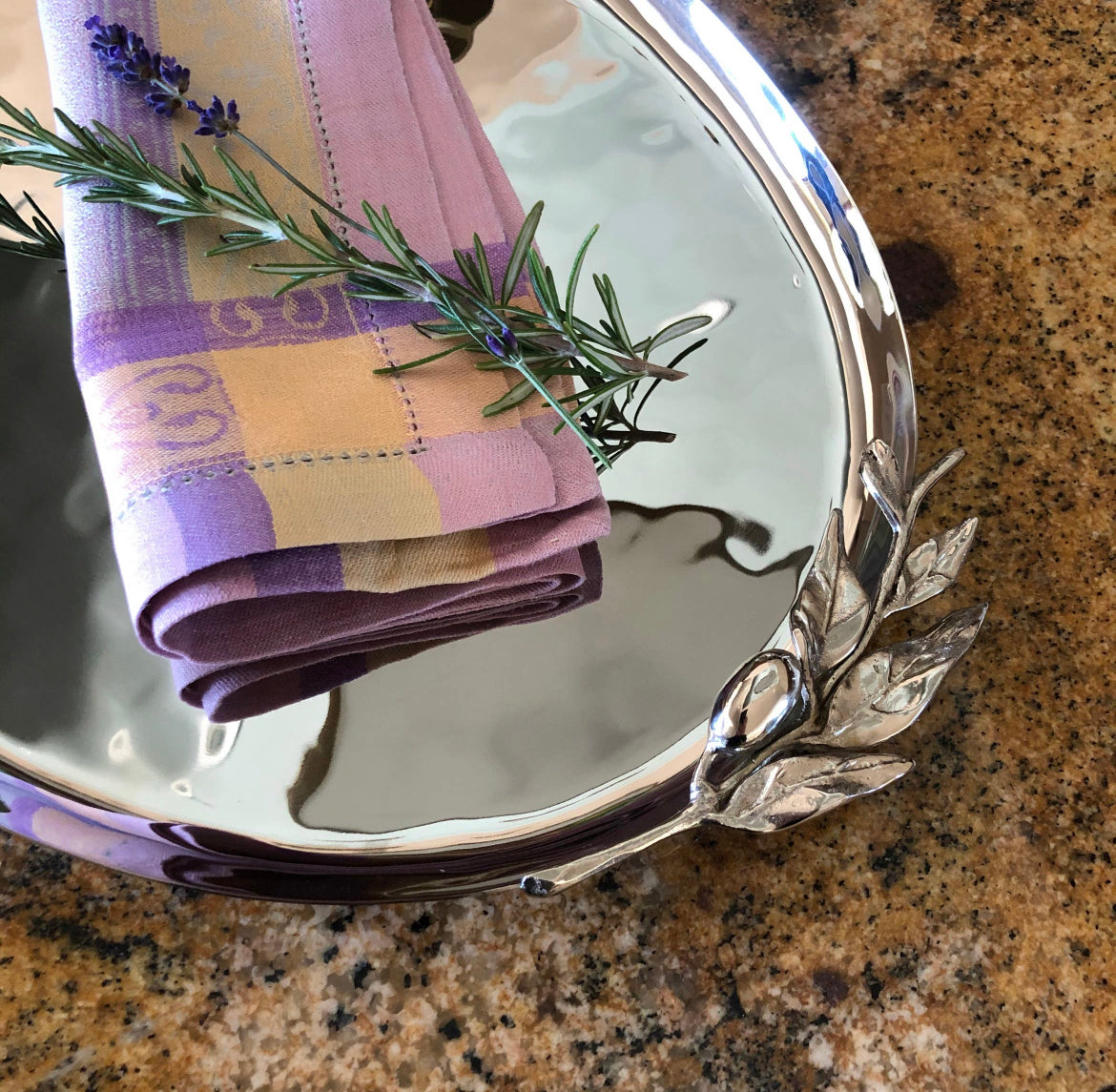 23 inch Stainless Steel Centerpiece Serving Tray with hammered textures and olive leaf designs on the edges.
