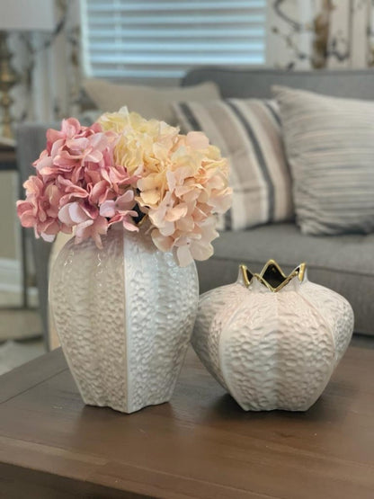 This elegantly crafted white and gold pomegranate ceramic vase will definitely beautify your home decor. These stunning vases have a fun shape and look so beautiful with your favorite faux florals!
