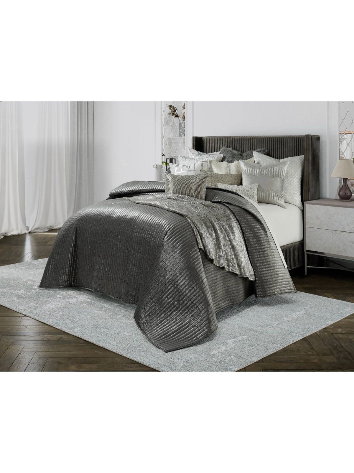 The Maya Dark Grey and Silver velvet quilt has a dominant silvery metal layer. The shiny silver will pair well in any toned-down area.