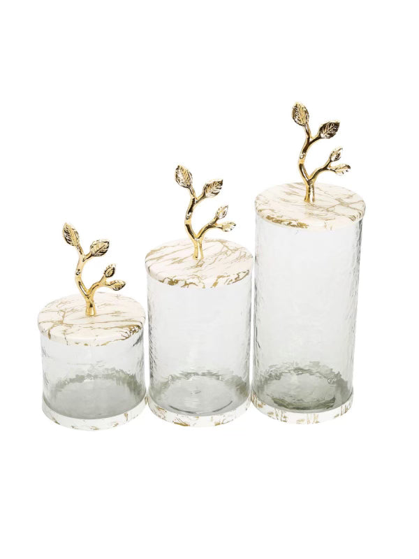 Luxury glass canisters with marble design and gold leaf details on lid. Available in 3 sizes, sold by KYA Home Decor.
