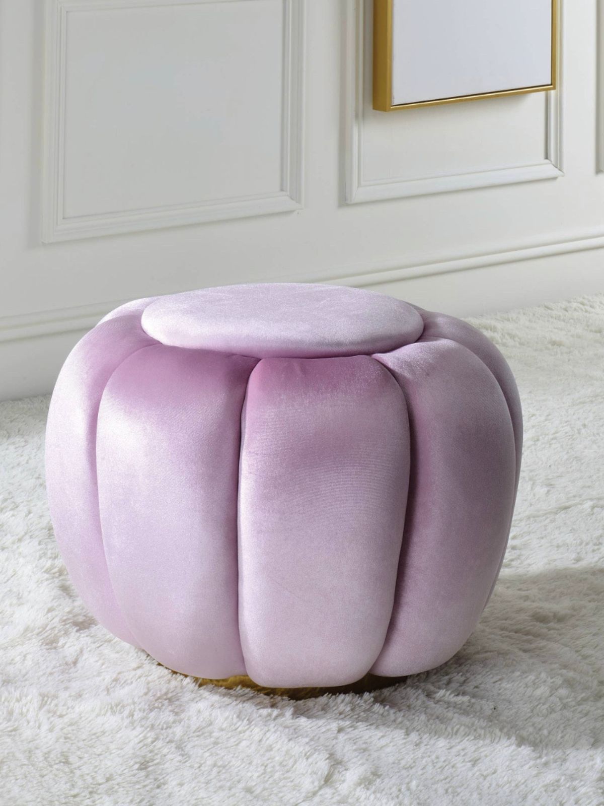 This Heiress ottoman is fully padded with sapphire bubblegum pink velvet & has a metal round base in a gold finish. This design will go well with any home décor.