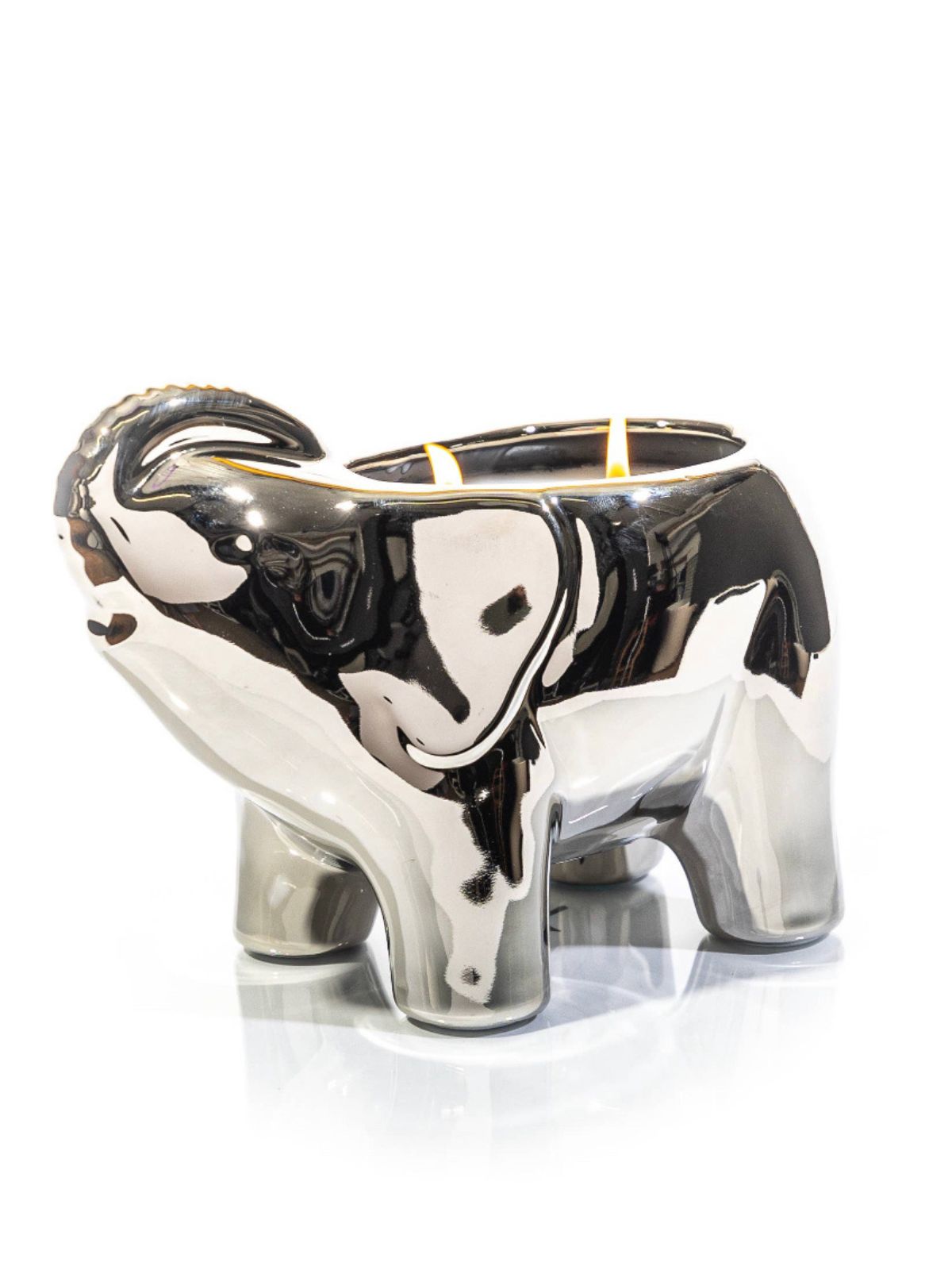 This elegant silver elephant candle is designed and finished by hand sculpting the ceramic of each vessel. These candles are then hand filled with a proprietary soy wax blend, all natural essential oils, and 2 cotton wicks to provide a clean burn.