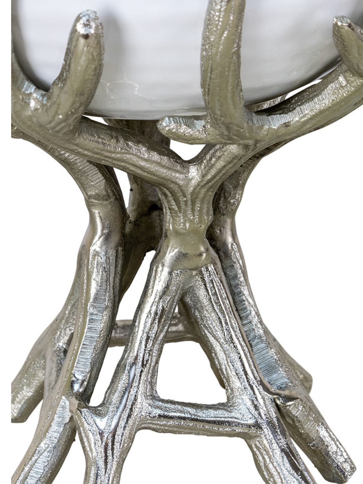 9.5D x 9H decorative white bowl with gold interior sitting on a silver branch stand, close up.