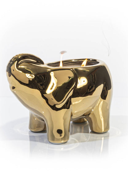 This elegant gold elephant candle is designed and finished by hand sculpting the ceramic of each vessel. These candles are then hand filled with a proprietary soy wax blend, all natural essential oils, and 2 cotton wicks to provide a clean burn.