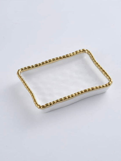 White Porcelain Soap Dish with Gold Beaded Edges Sold by KYA Home Decor.