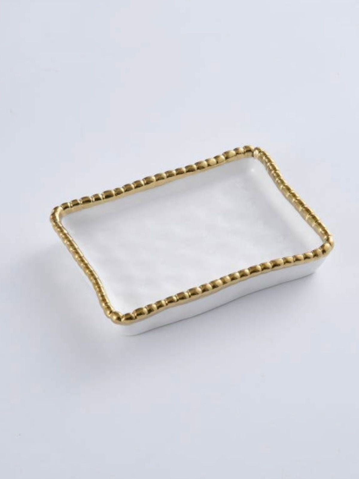 White Porcelain Soap Dish with Gold Beaded Edges Sold by KYA Home Decor.