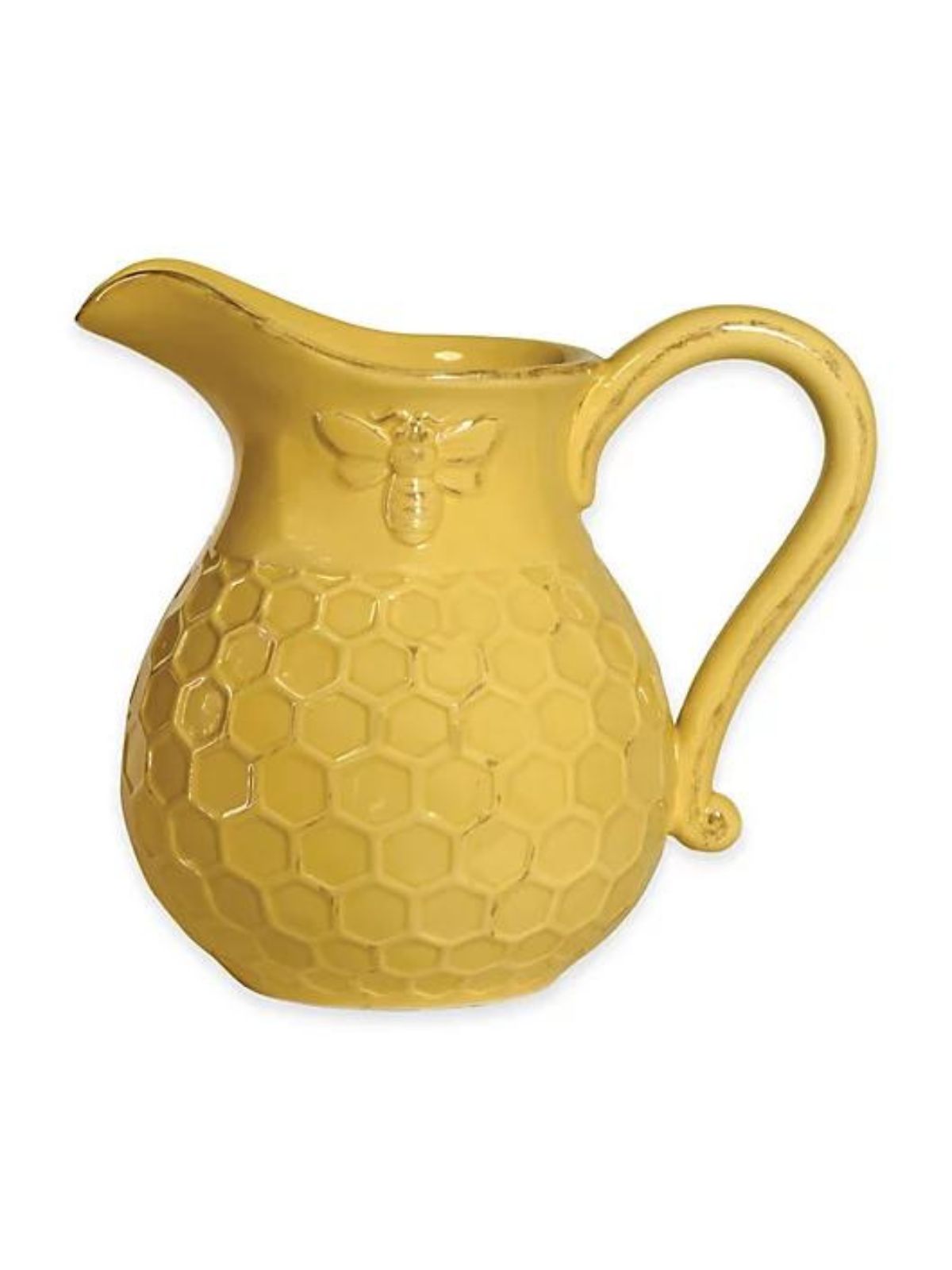 Make a bold statement at any meal with this charming Honeycomb Pitcher. Crafted in durable ceramic, each dark yellow piece is embossed with a honeycomb pattern and a bee. 
