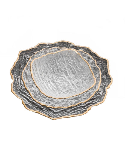 Serving your guest on this plates will defiantly make a statement. This set of 12 plates were constructed out of crushed glass material and designed with a gold trim. 