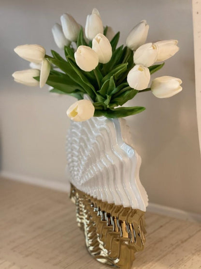 Beautify your home decor with our elegant Starlet White and Gold Vase. This unique vase features modern and sophisticated craftsmanship. The exquisite shape adds an attractive look.