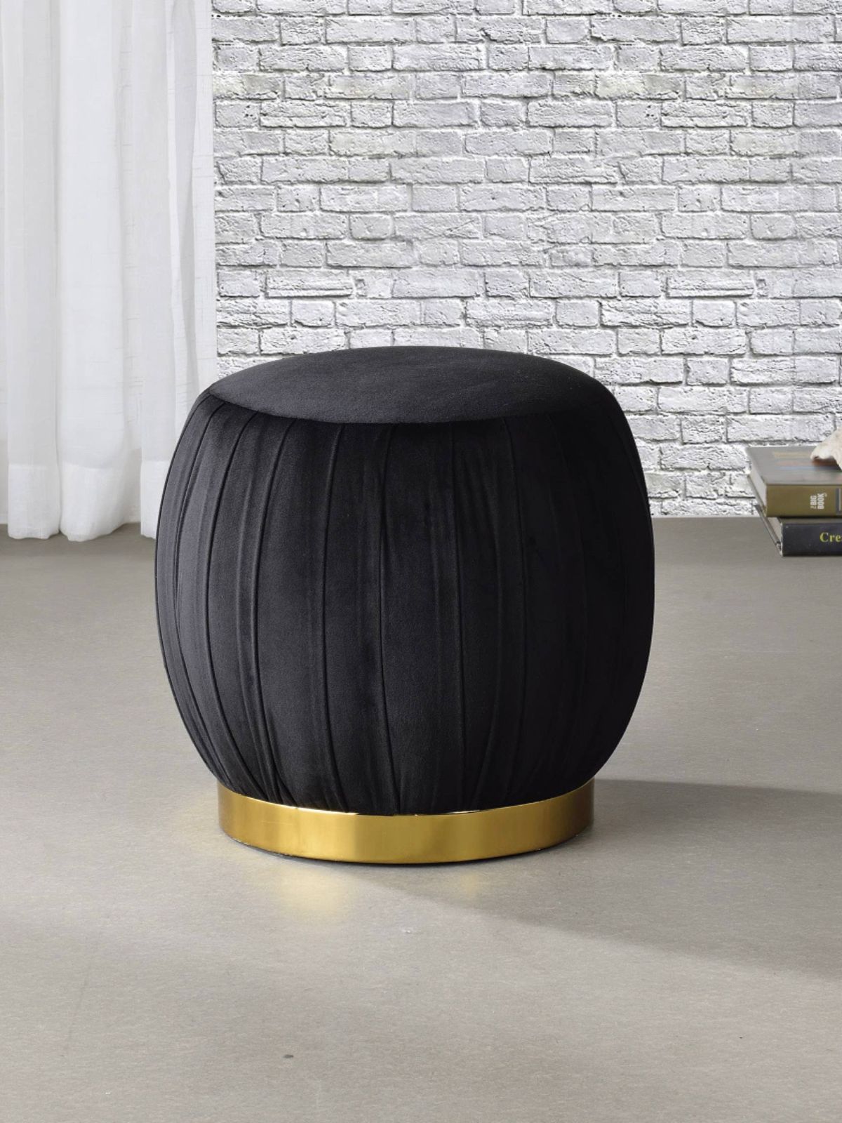 This Zinnia ottoman features a metal base in a gold finish and fully padded seat in velvet fabric showcasing a modern appearance that will sure to grab glances.  