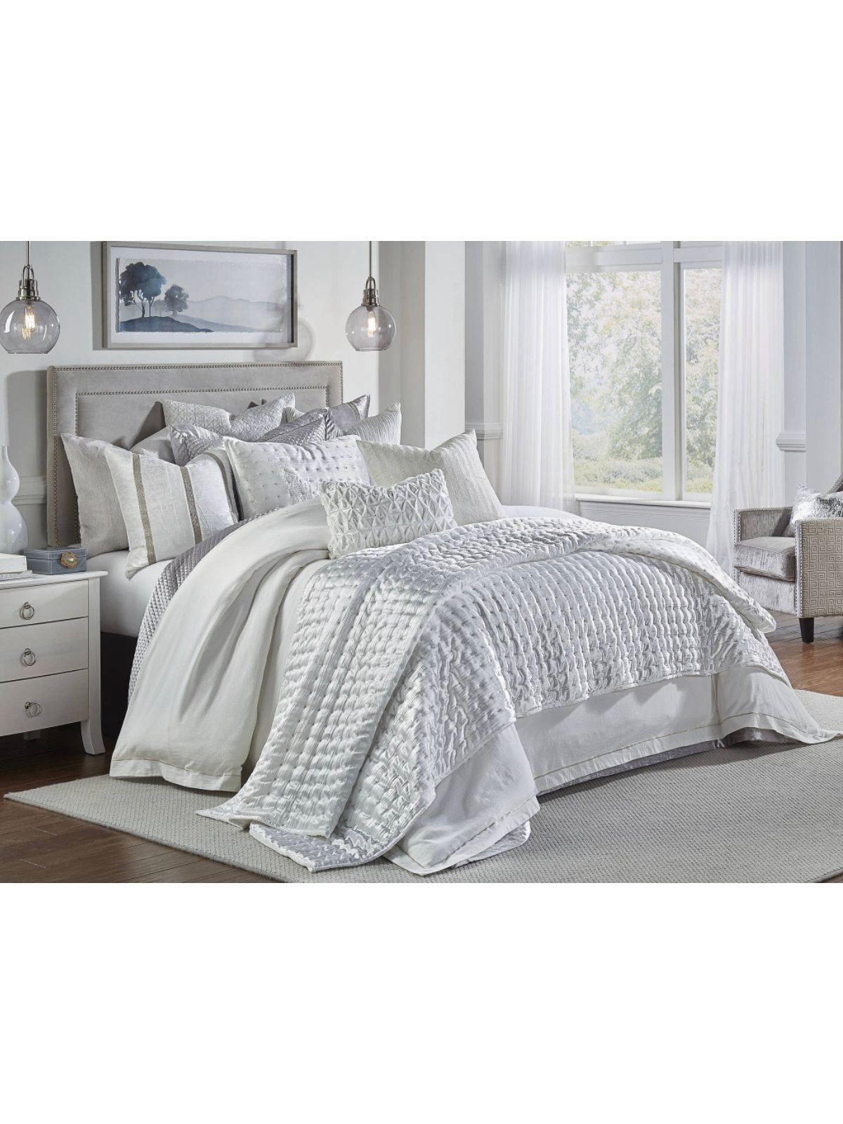 The Prato quilt features a crushed ivory fabric with metallic dots embroidered and is quilted in a square pattern. This cozy layer is the perfect addition to any room. 