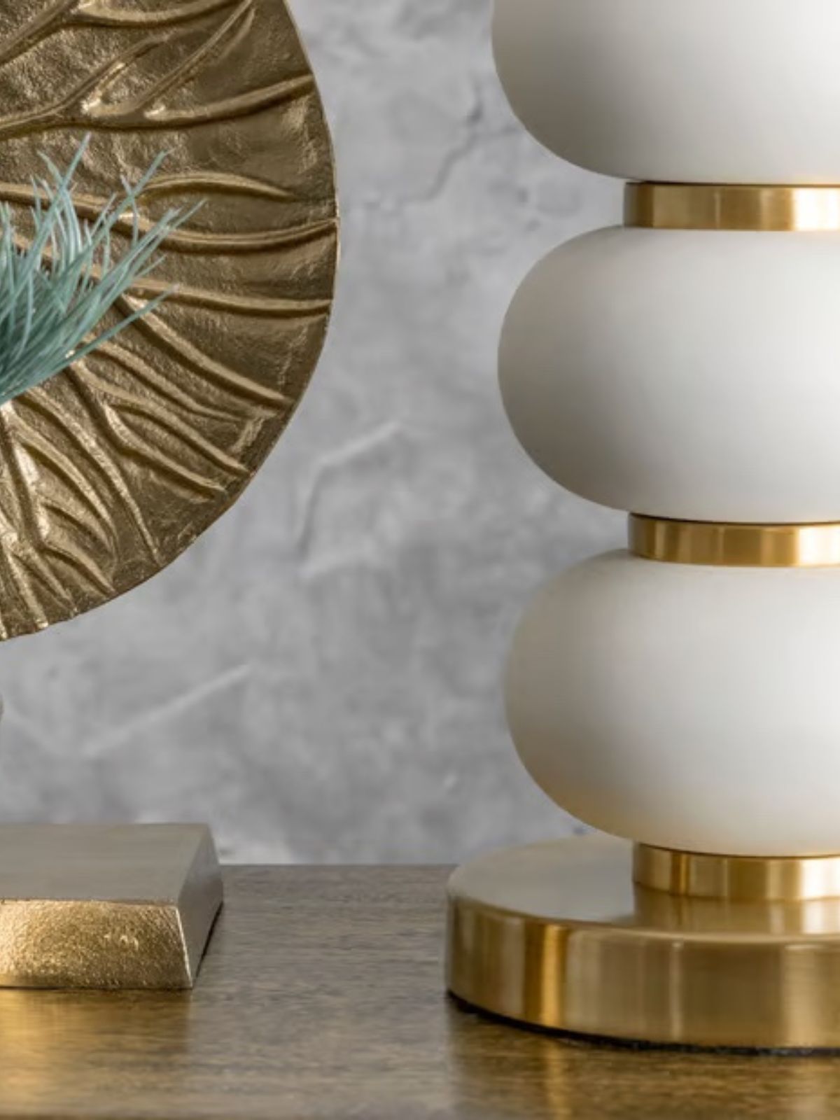 Gold Metal Table Lamp with White Oval Bead Design Staged on Desk.