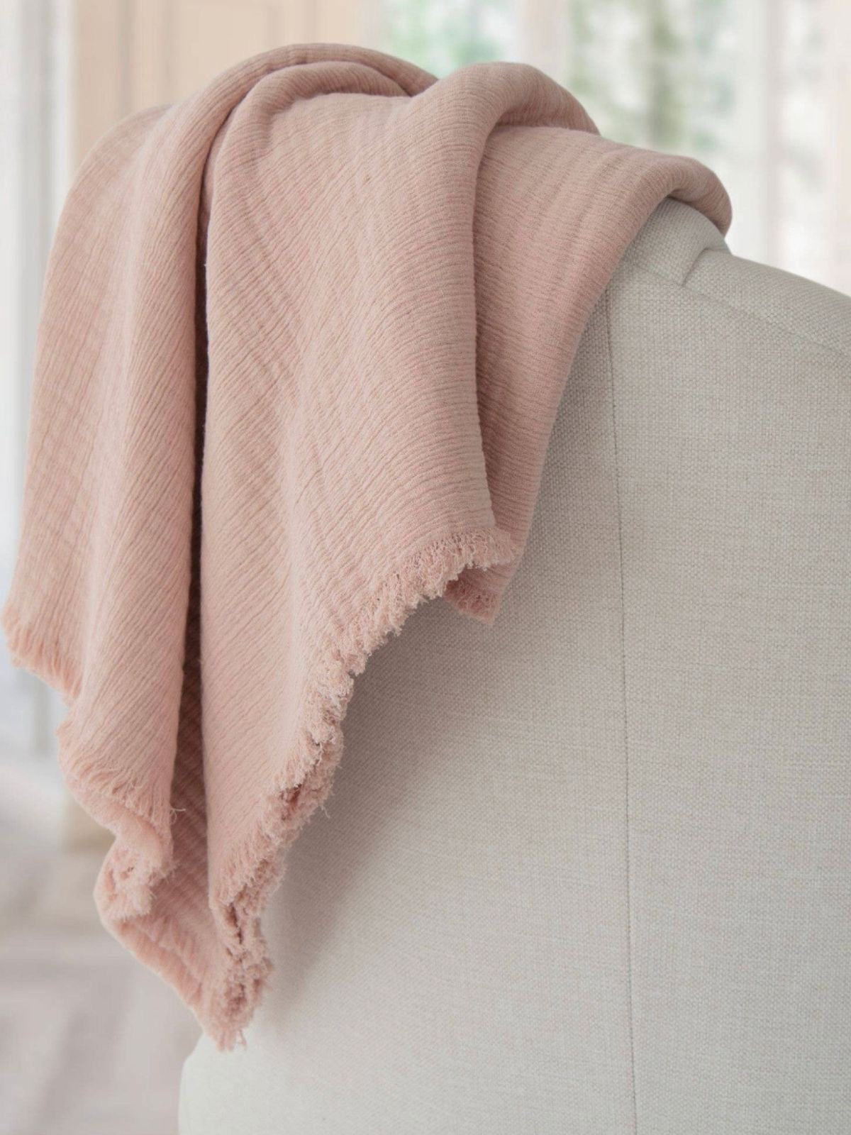 100% Cloud Gauze Cotton Throw Blanket with Frayed Edge in Blush color Sold by KYA Home Decor.