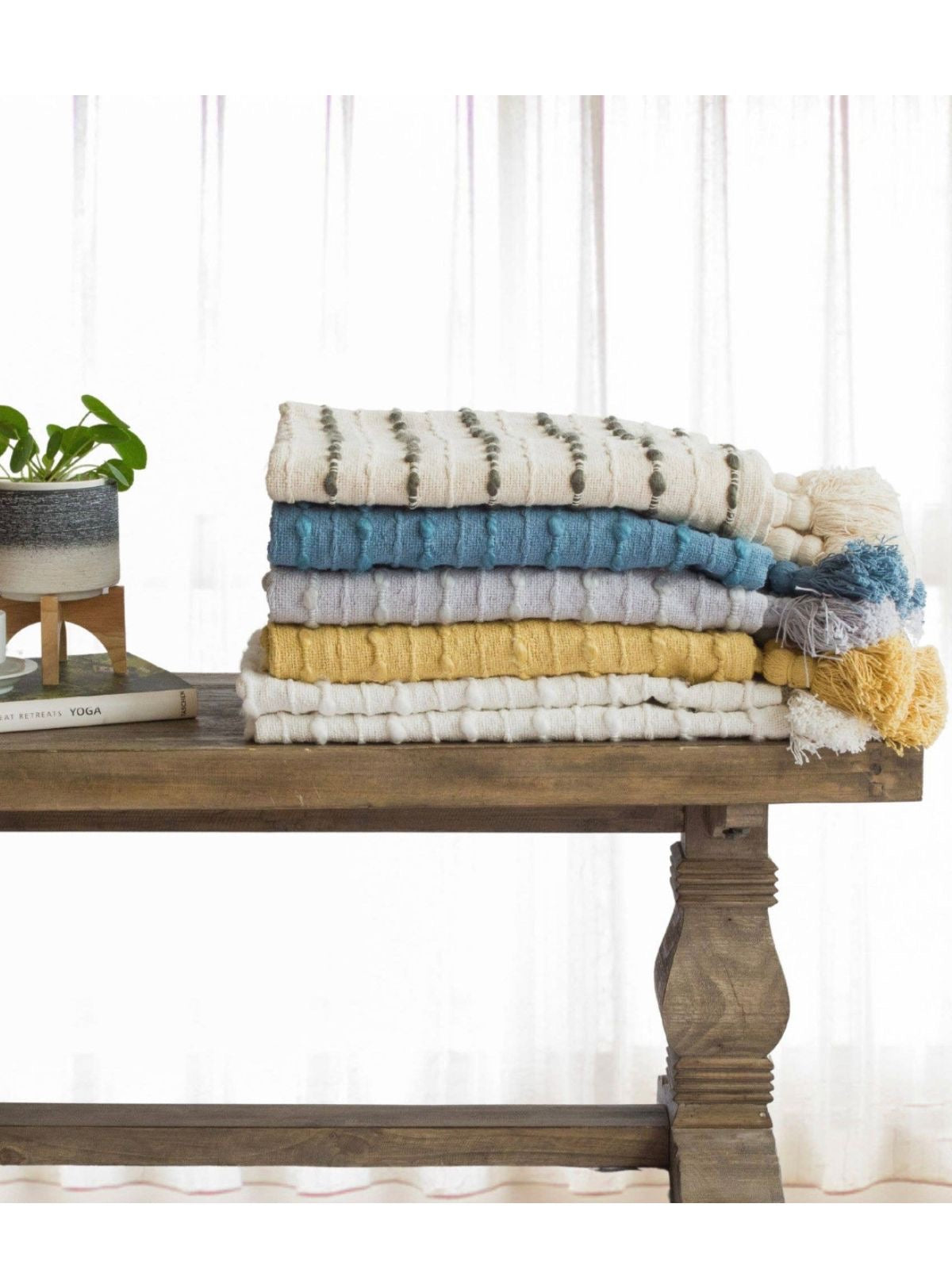 This handmade decorative throw blanket is made from linen-look weaved fabric sold by KYA Home Decor, 50W x 60L.