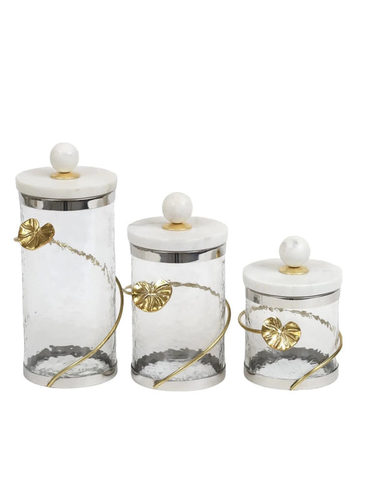 These Glass Canister with Gold Metal Heart Design and Marble Lid are available in 3 sizes and Sold by KYA Home Decor